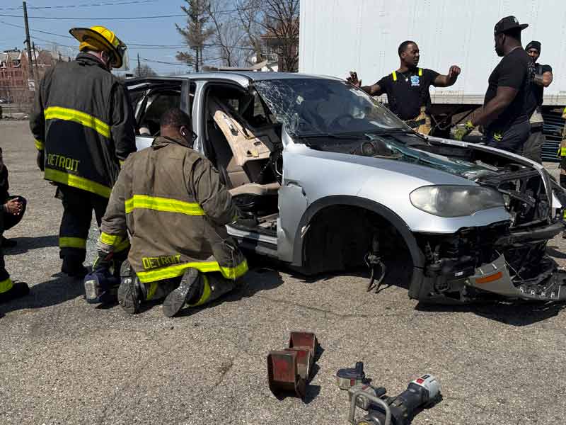 Detroit firefighters training on car